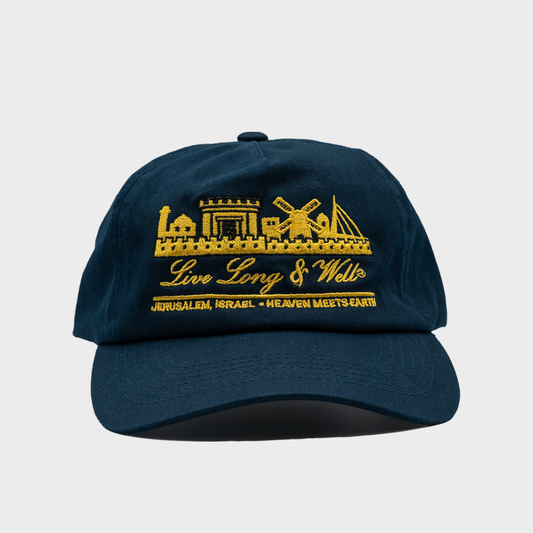 Navy blue cap with yellow embroidered design and text on a light gray background